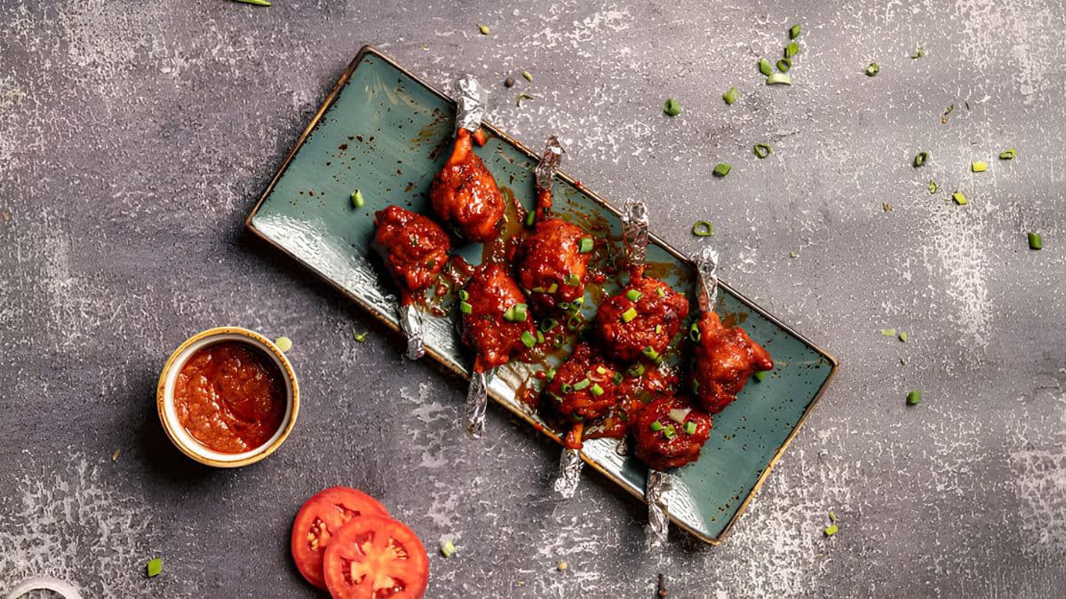 Chicken lollipop pieces on a plate