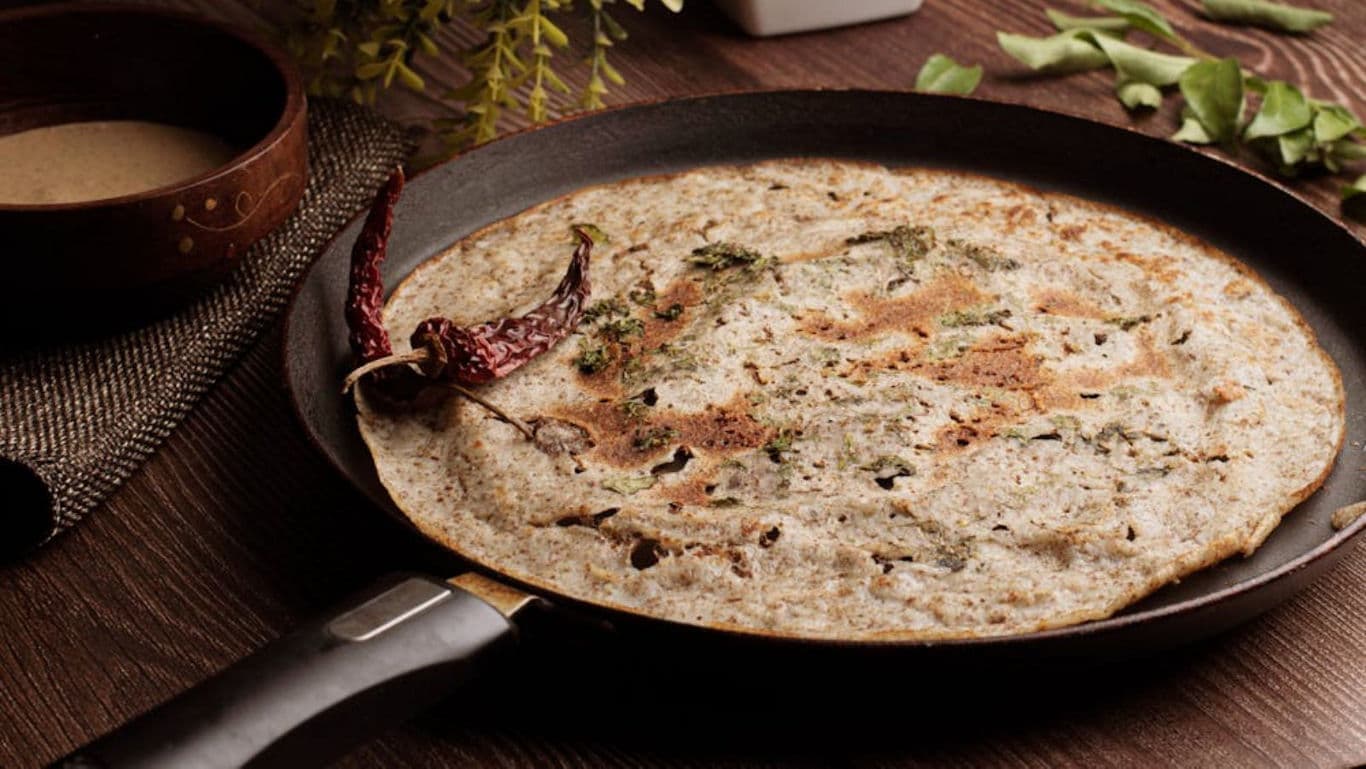 Crispy Indian dosa cooking in nonstick pan