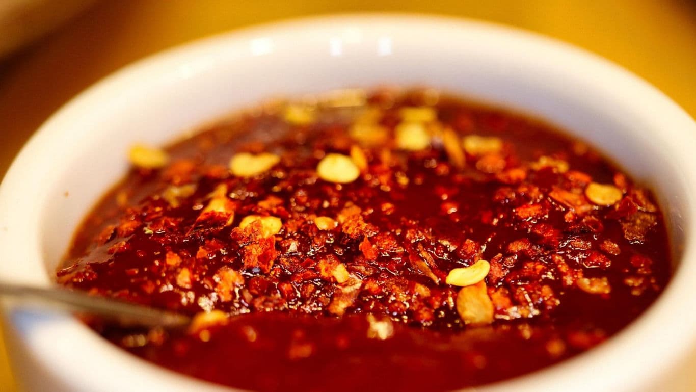 Spicy Red Chili Oil in White Ceramic Bowl