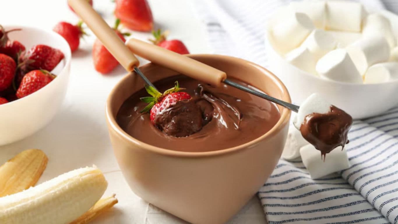 Chocolate fondue with strawberries, bananas, and marshmallows