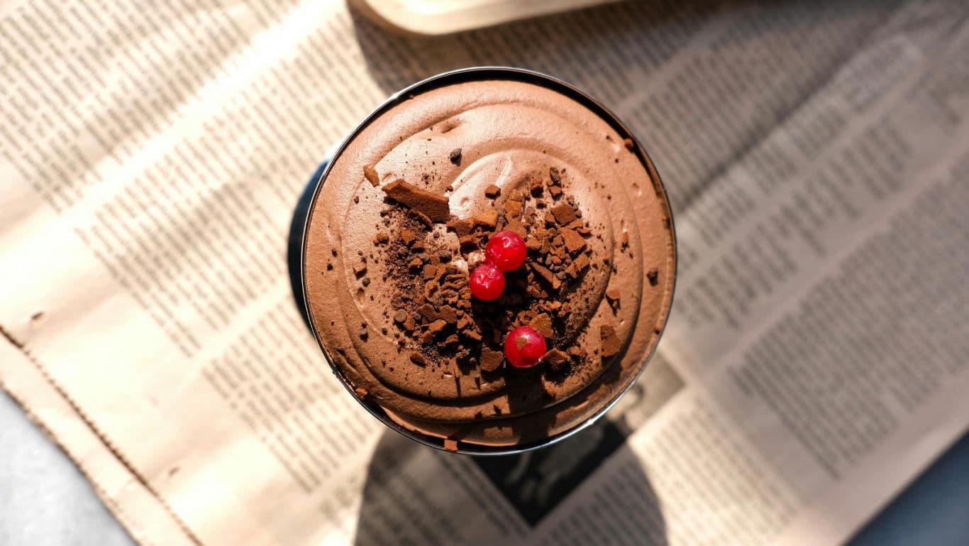 Chocolate mousse dessert with red berries on top