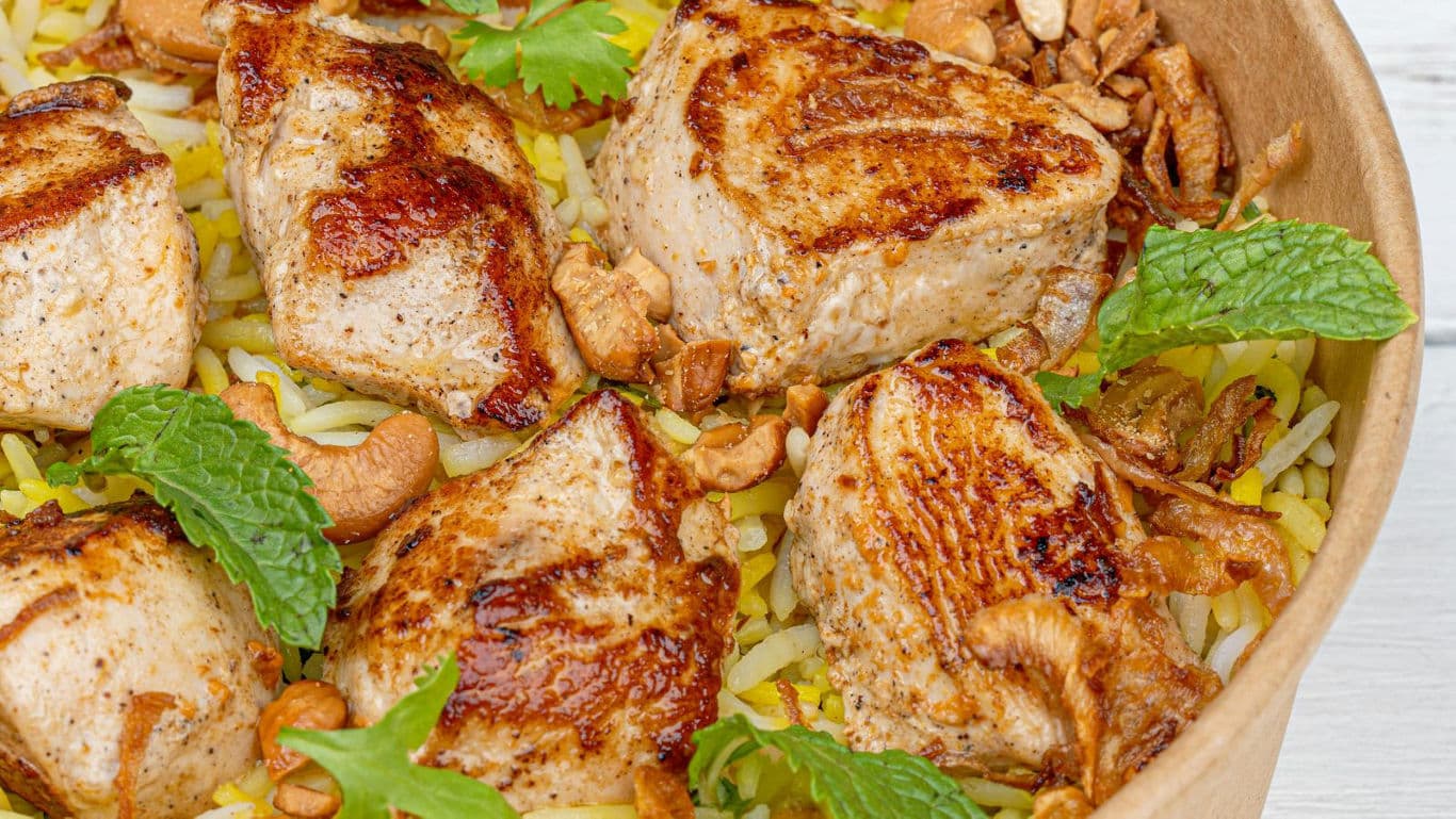 Grilled Chicken Biryani with Cashews and Mint Garnish