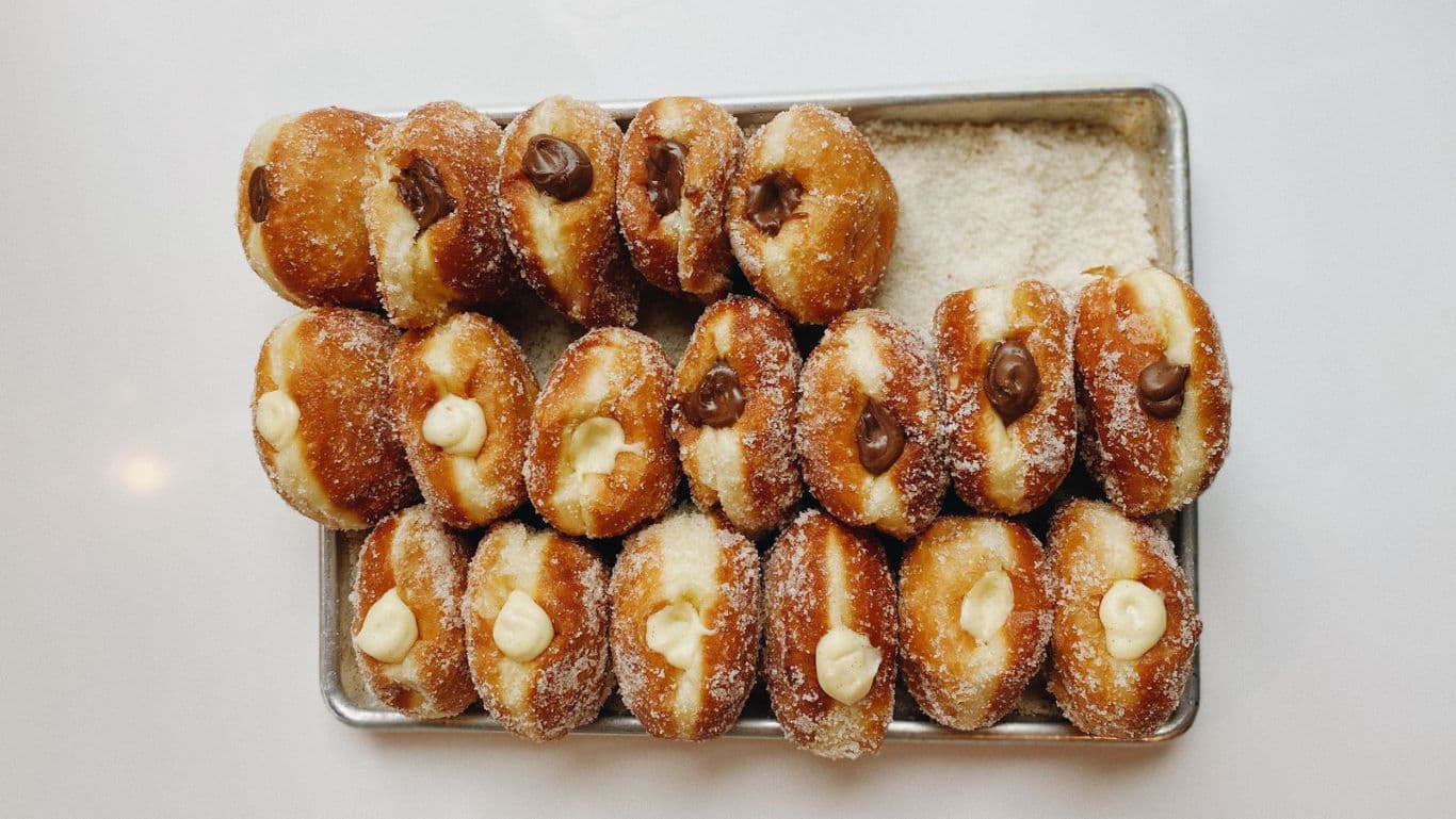 Tray of assorted cream-filled doughnuts