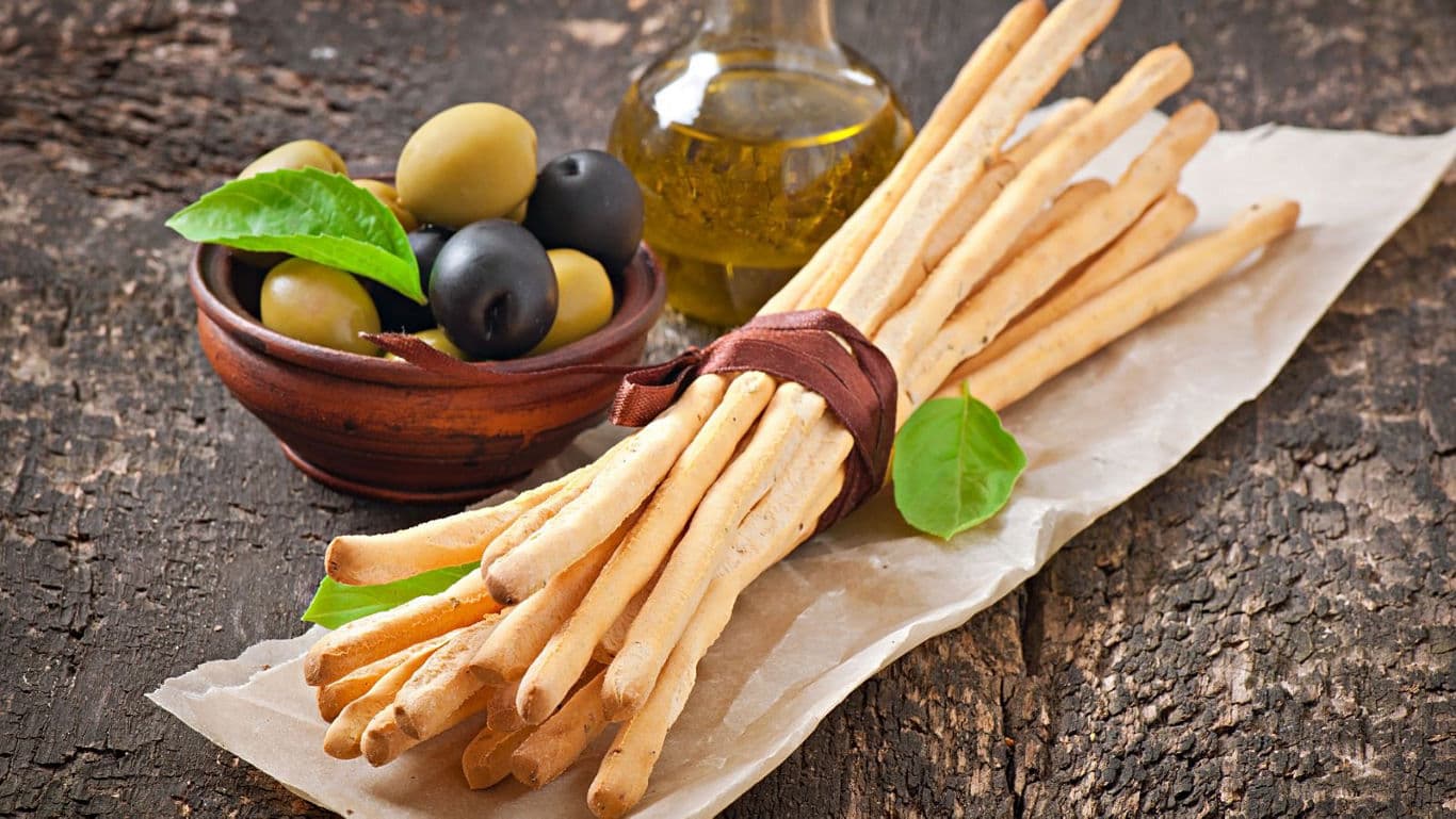 Italian breadsticks with olives and olive oil