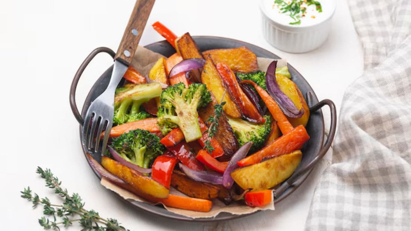 Colorful roasted vegetables in rustic setting