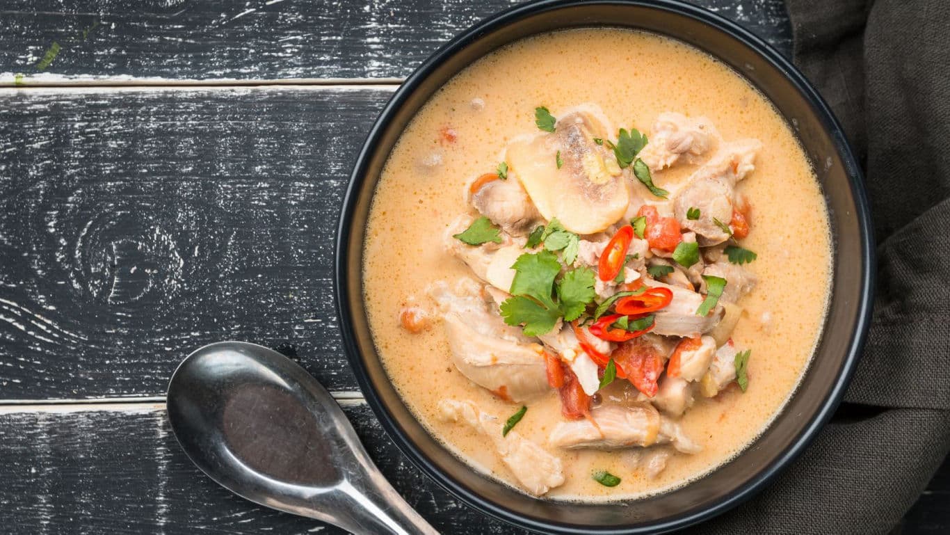 Creamy chicken soup with chili garnish