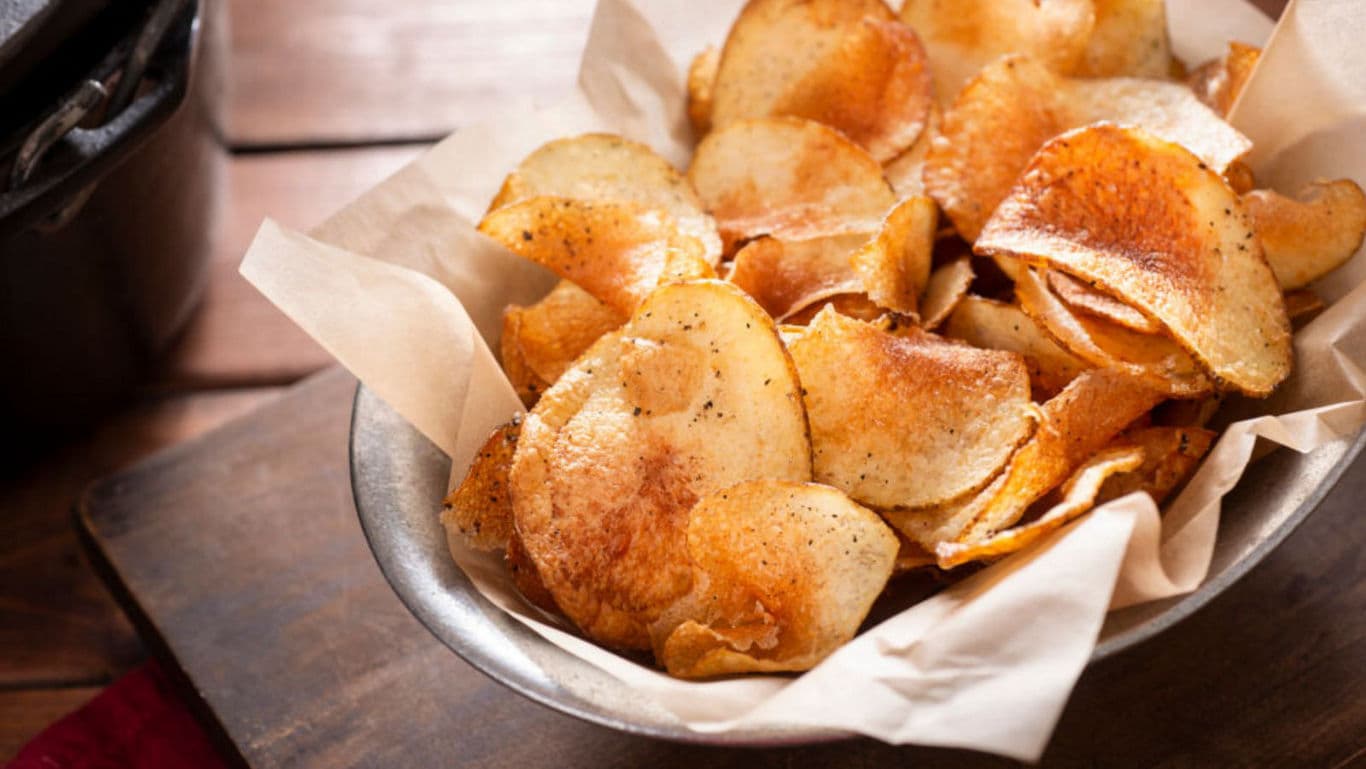 Crispy Homemade Potato Chips in Rustic Bowl