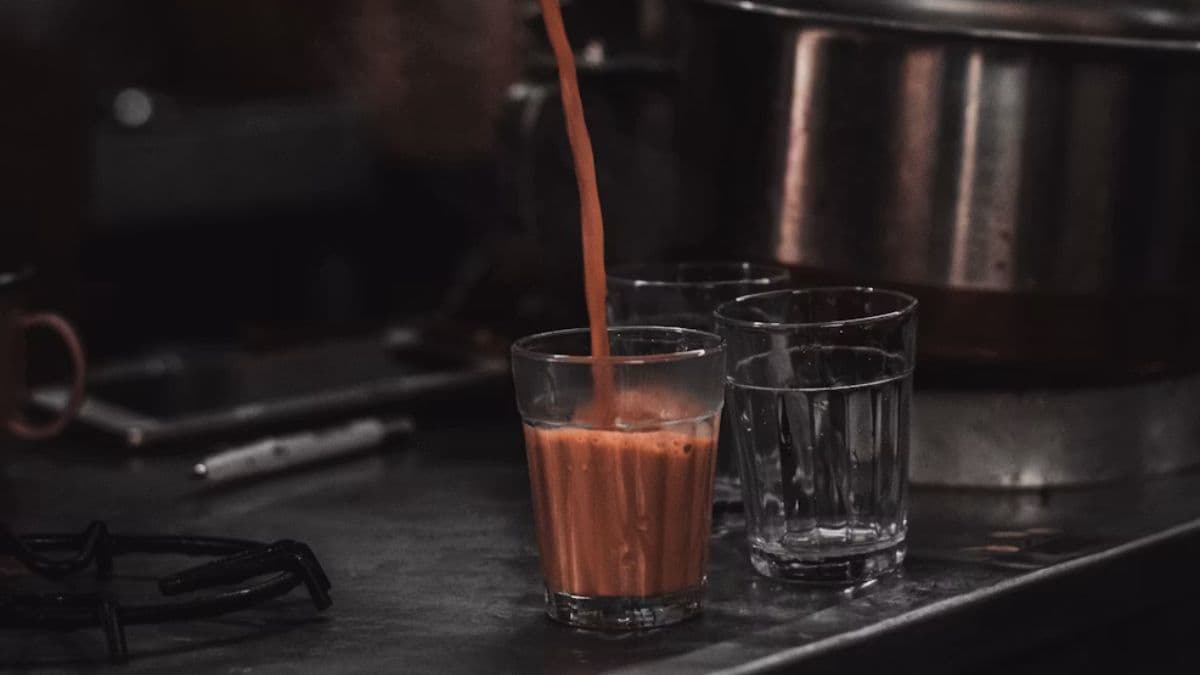 Pouring tea from a kettle