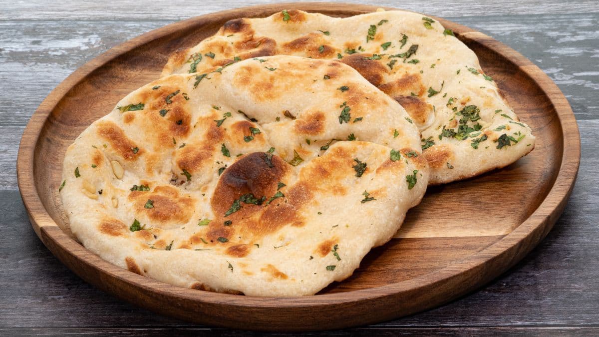 2 pieces of pita bread on a brown plate