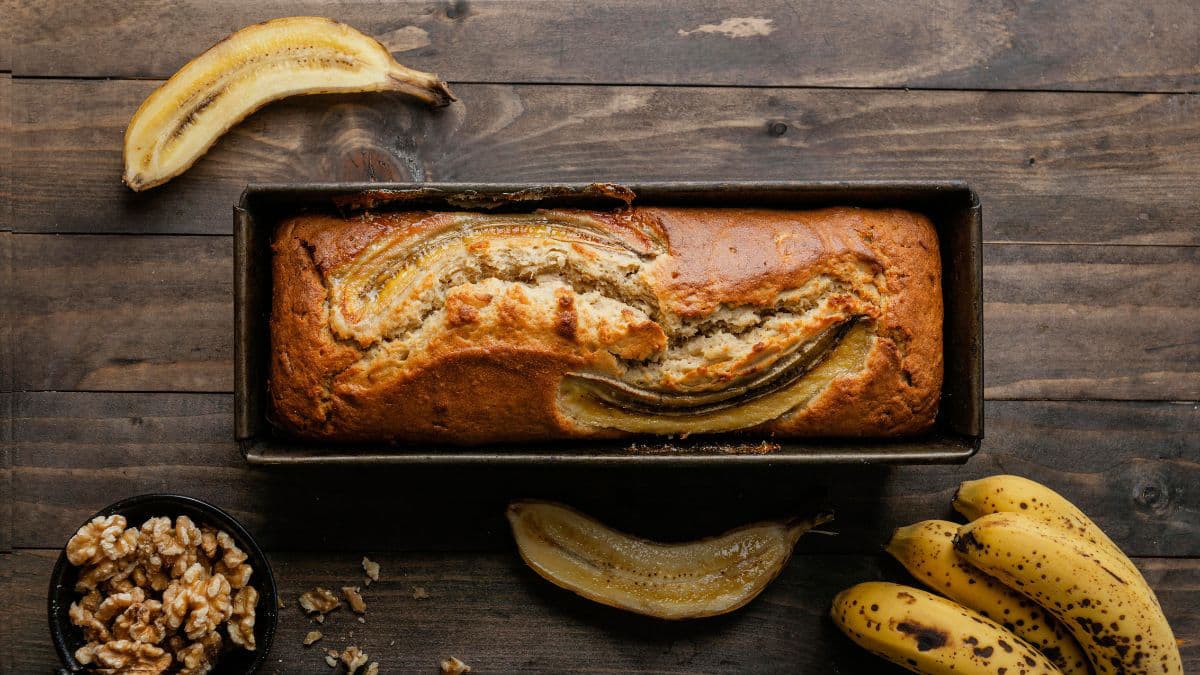 khapli wheat banana bread with bananas on the side