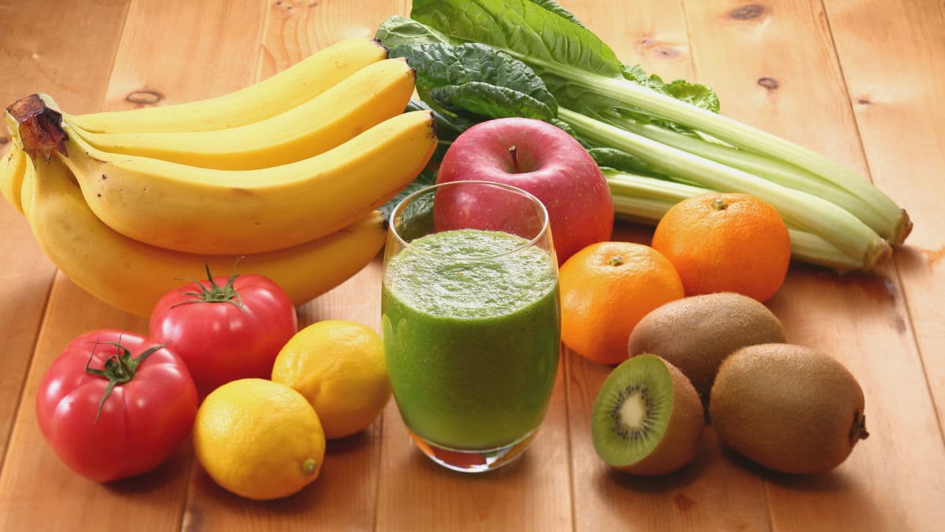 Fresh fruits and vegetables with green smoothie
