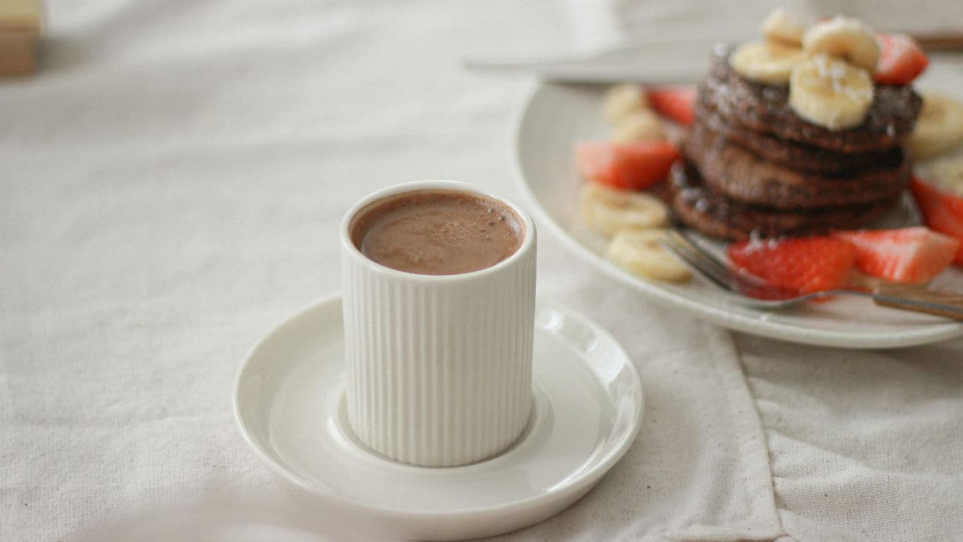 Hot chocolate and pancakes breakfast scene