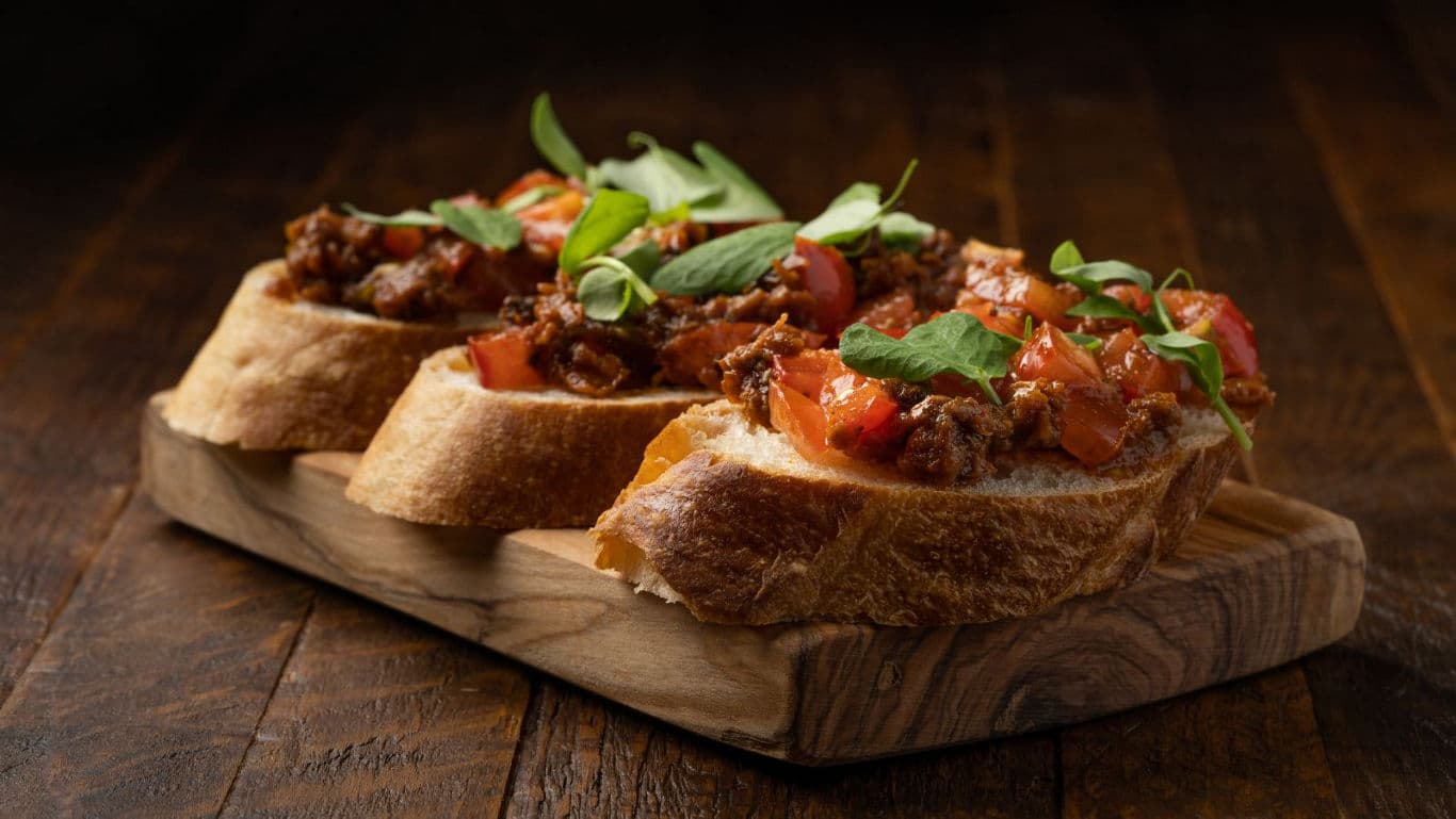 Gourmet bruschetta with meat and tomatoes