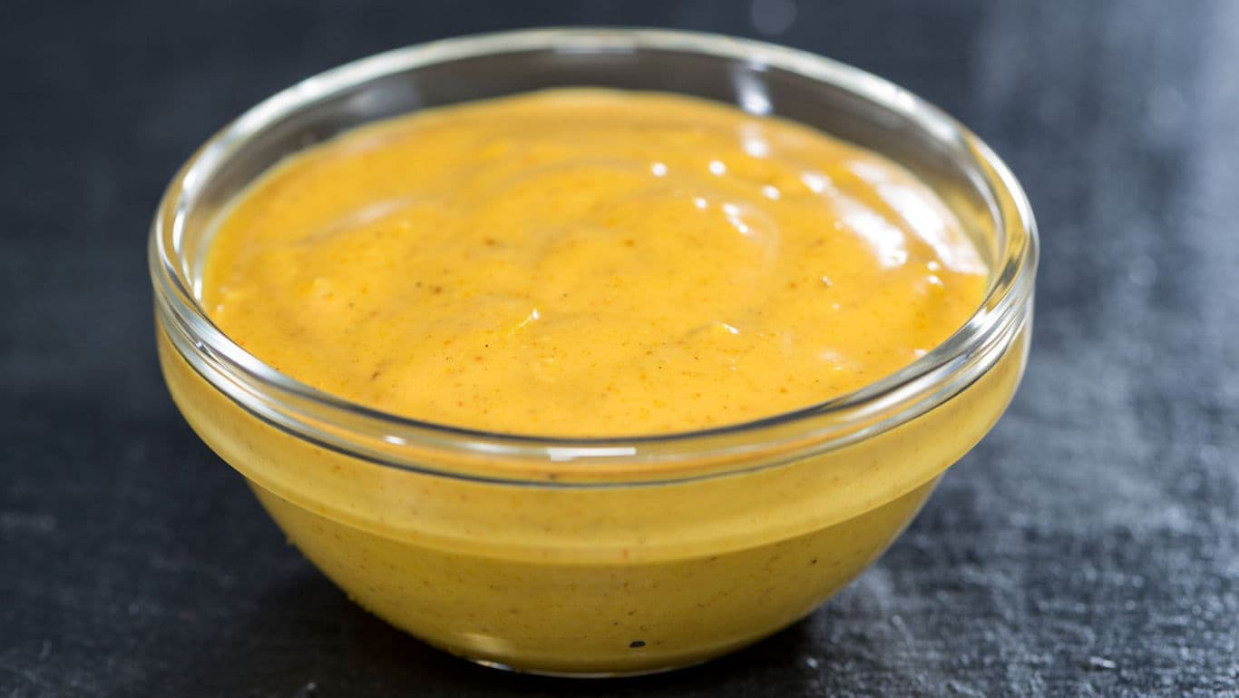 Small Glass Bowl Filled With Yellow Mustard Sauce