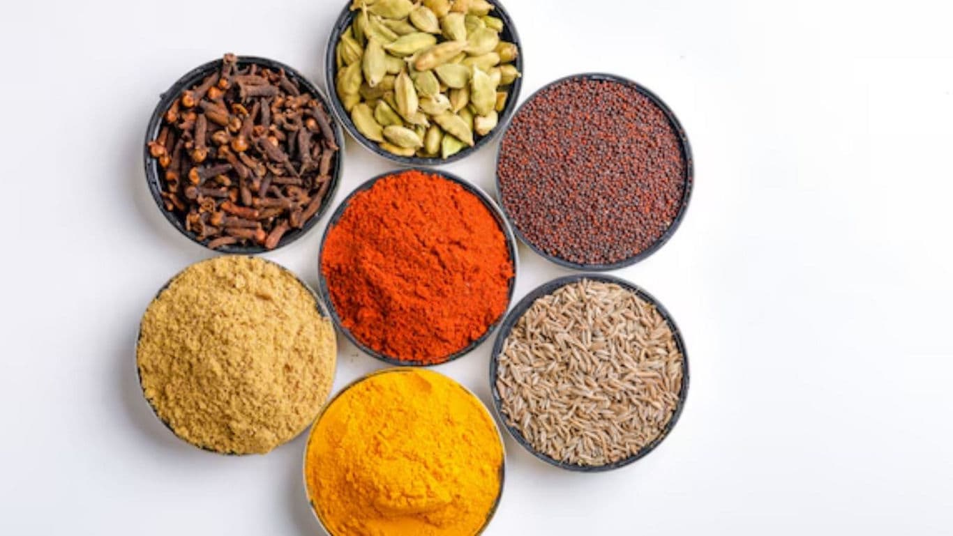 Assorted colorful spices in round bowls