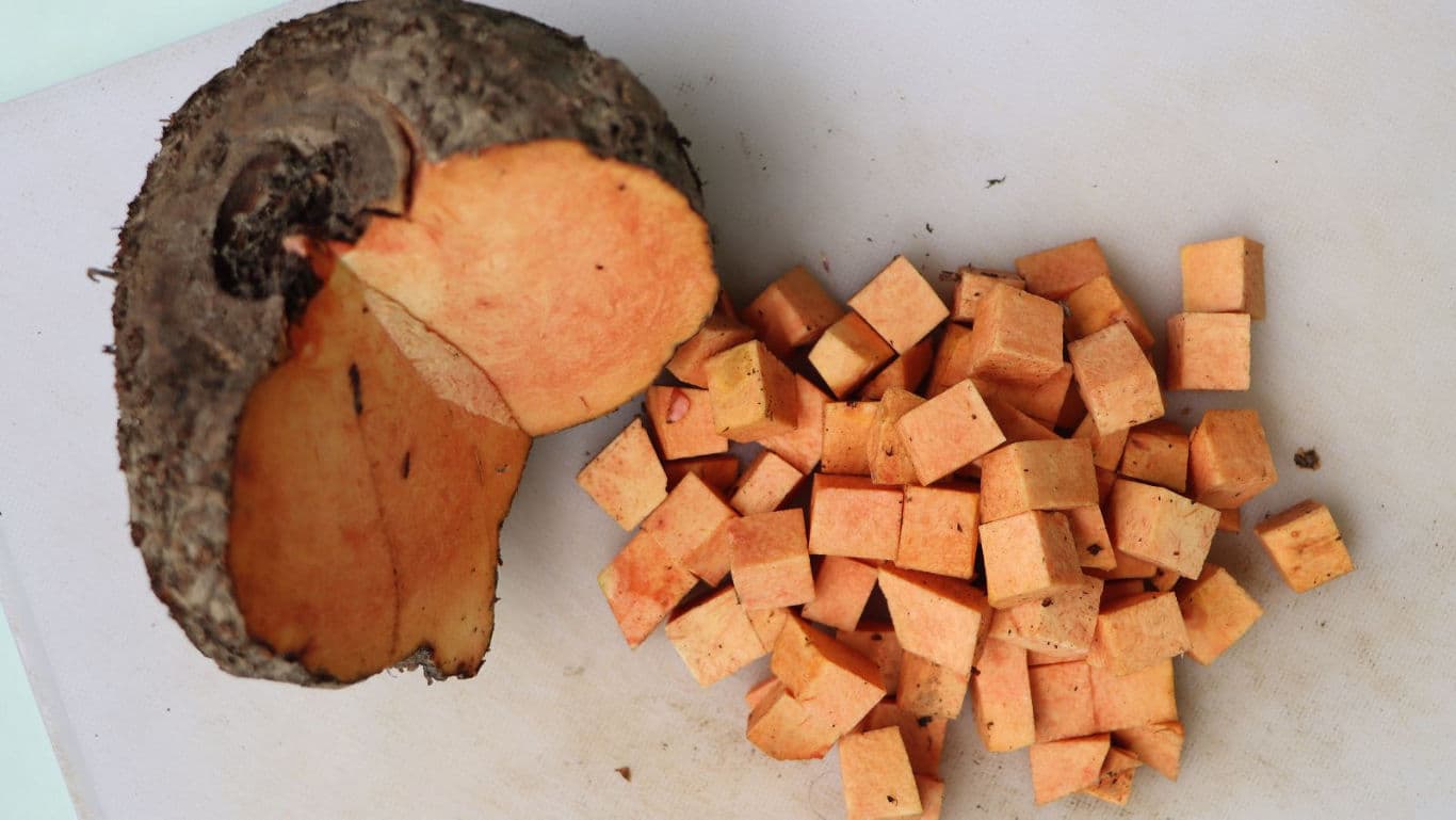 Cubed Orange Yam on White Cutting Board