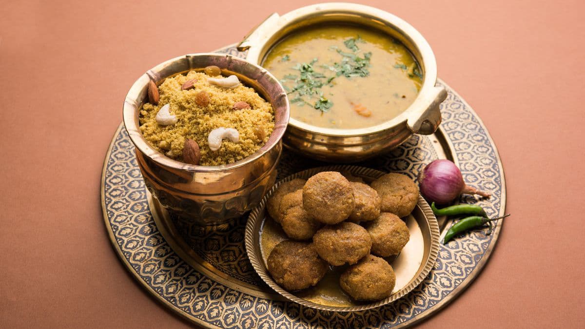 Daal baati churma on a brass plate