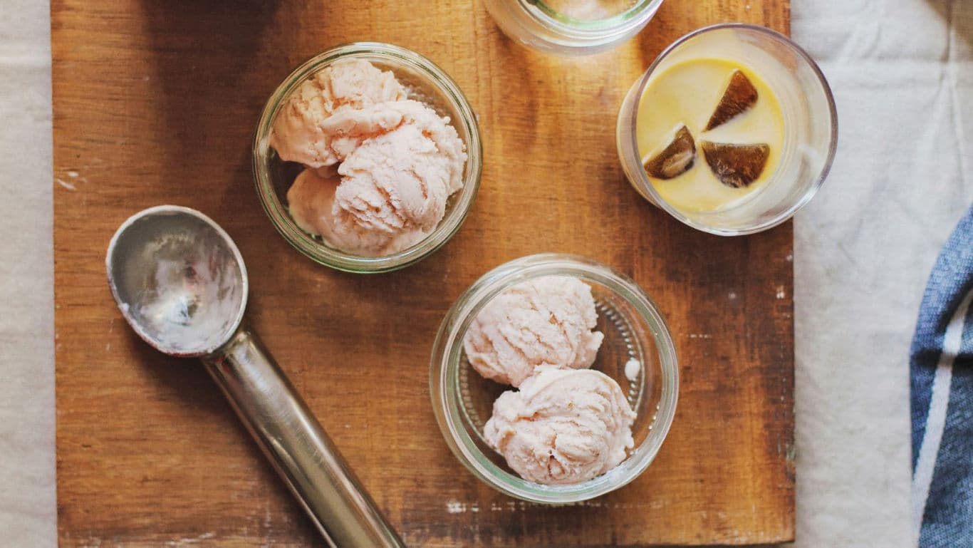 Homemade ice cream scoops on wooden board