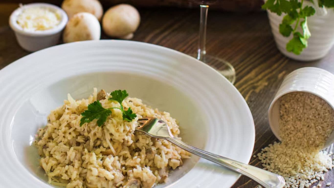 Creamy mushroom risotto with parsley garnish