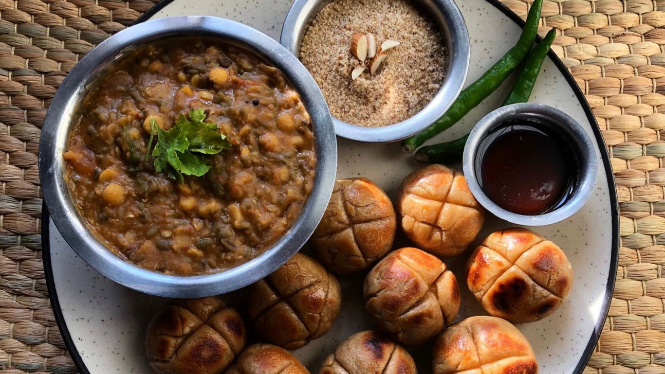 Traditional Indian Dal Baati with Chutney and Sides