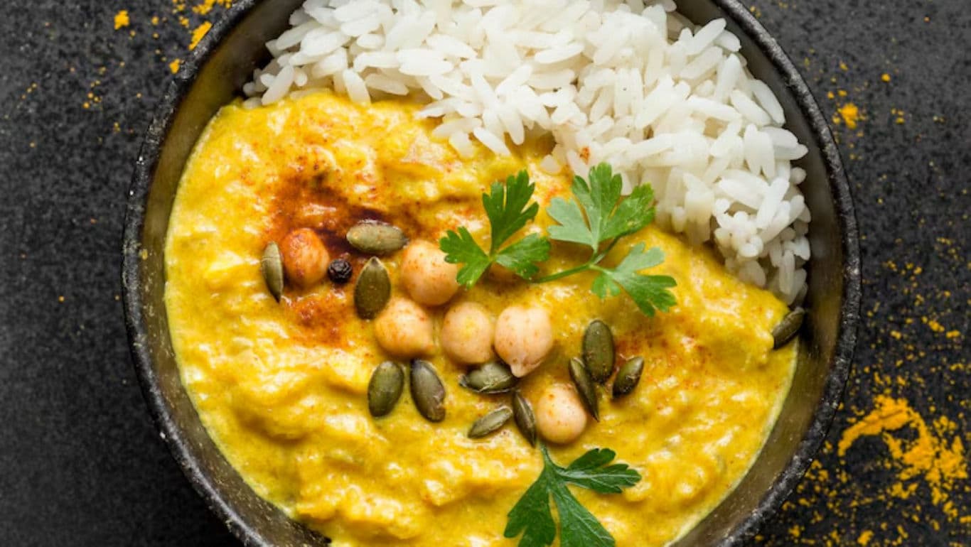 Bowl of Curry with Rice and Garnish