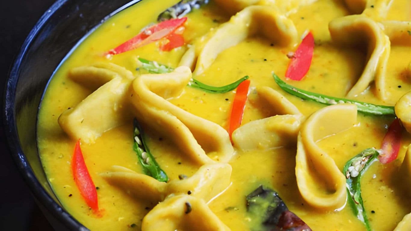 Traditional Indian Dal Dhokli in Yellow Lentil Curry