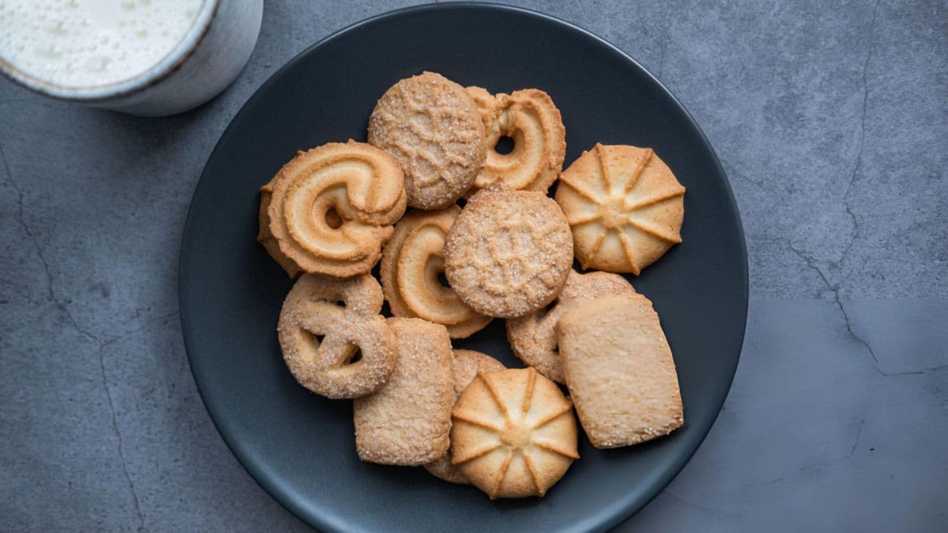Assorted butter cookies on dark plate