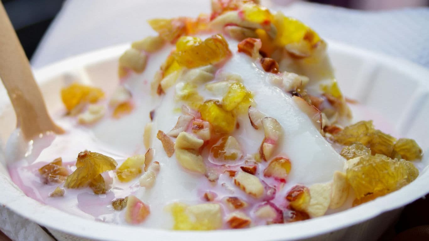 Creamy frozen dessert topped with fruit