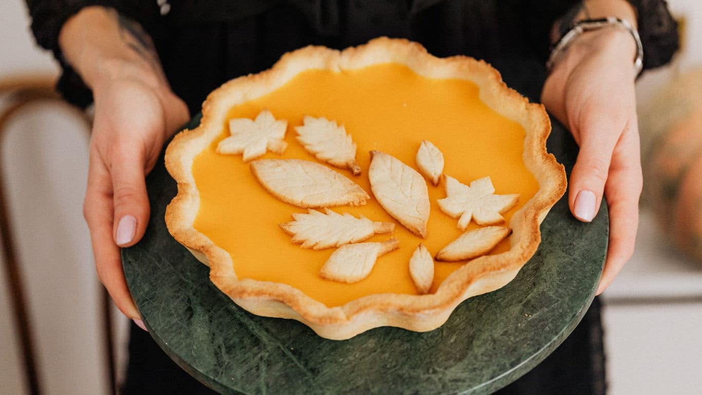 Pumpkin tart with leaf-shaped pastry decor