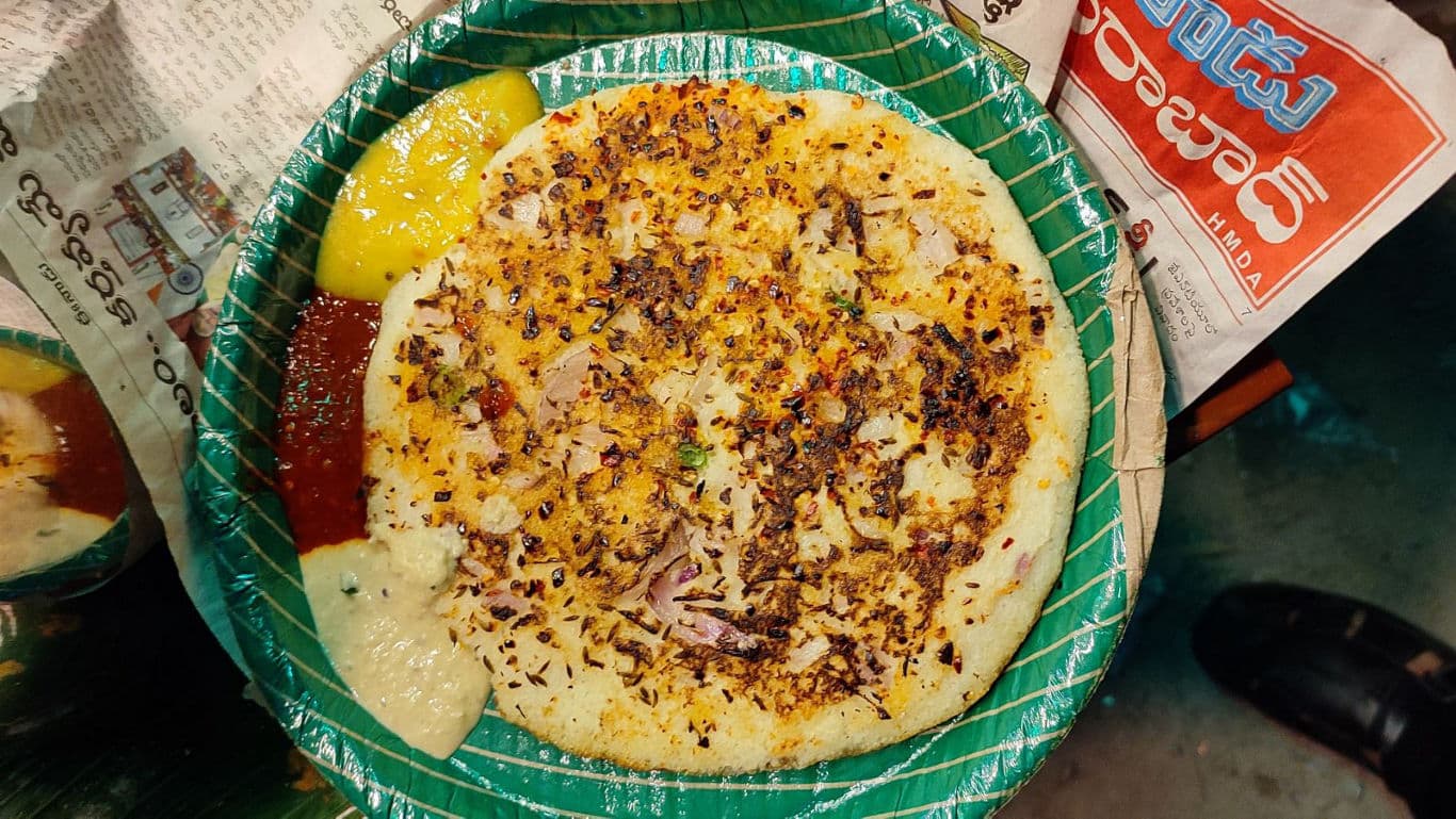 South Indian uttapam served with colorful chutneys