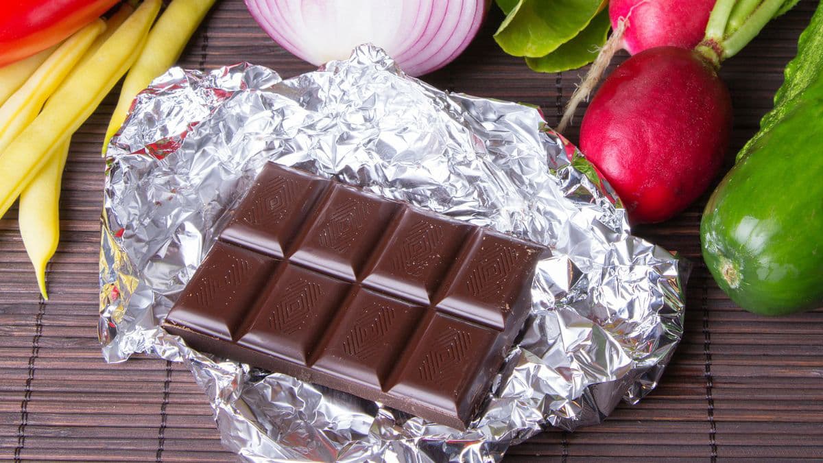 Chocolate bar surrounded by vegetables
