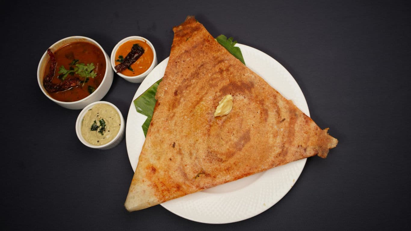 Crispy dosa with chutneys and sambar