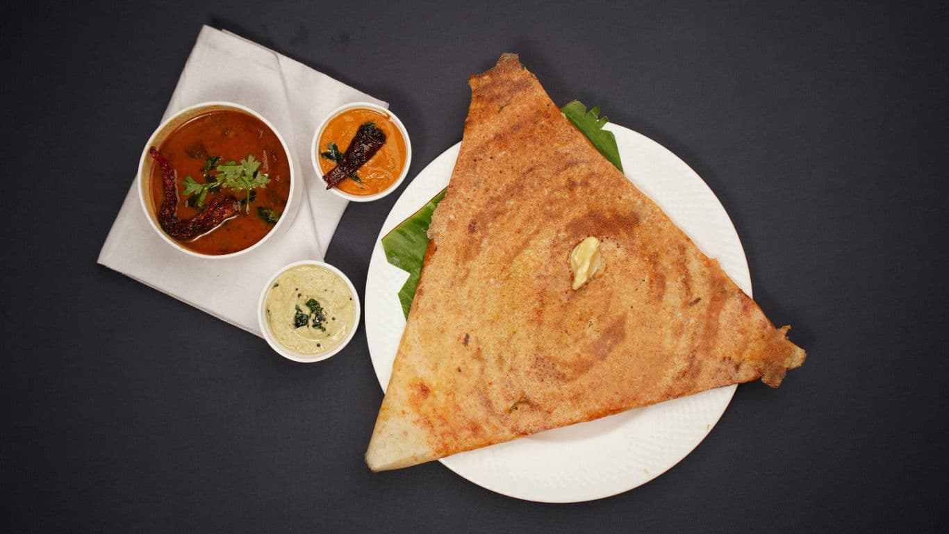 Crispy dosa with chutneys and sambar