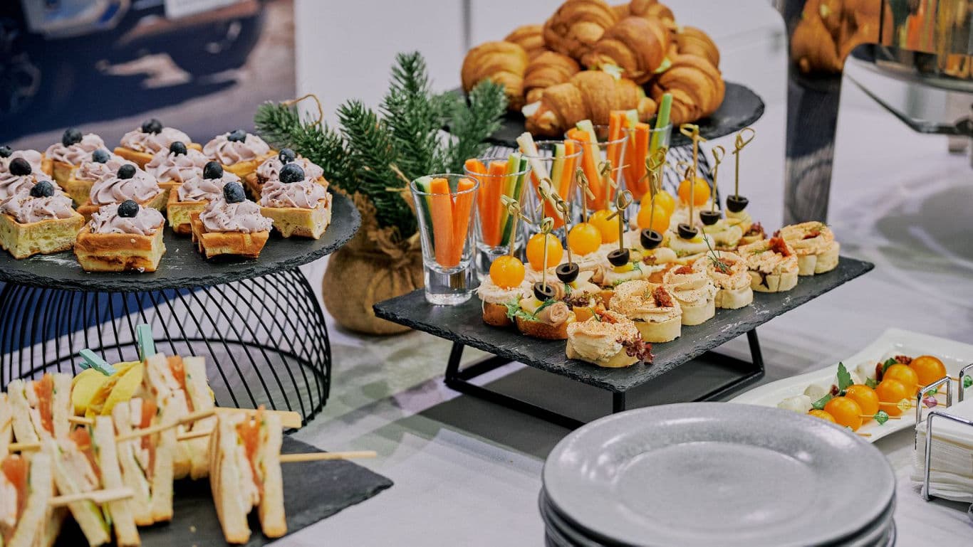 Assorted Gourmet Appetizers and Sandwiches on Buffet Table
