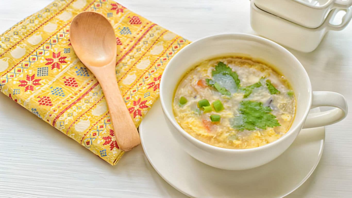 Warm soup in white ceramic bowl