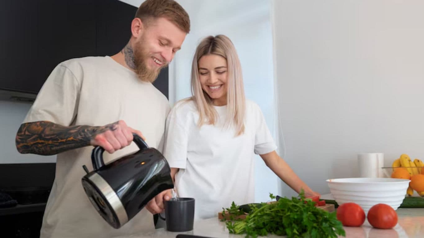 Couple preparing food in modern kitchen