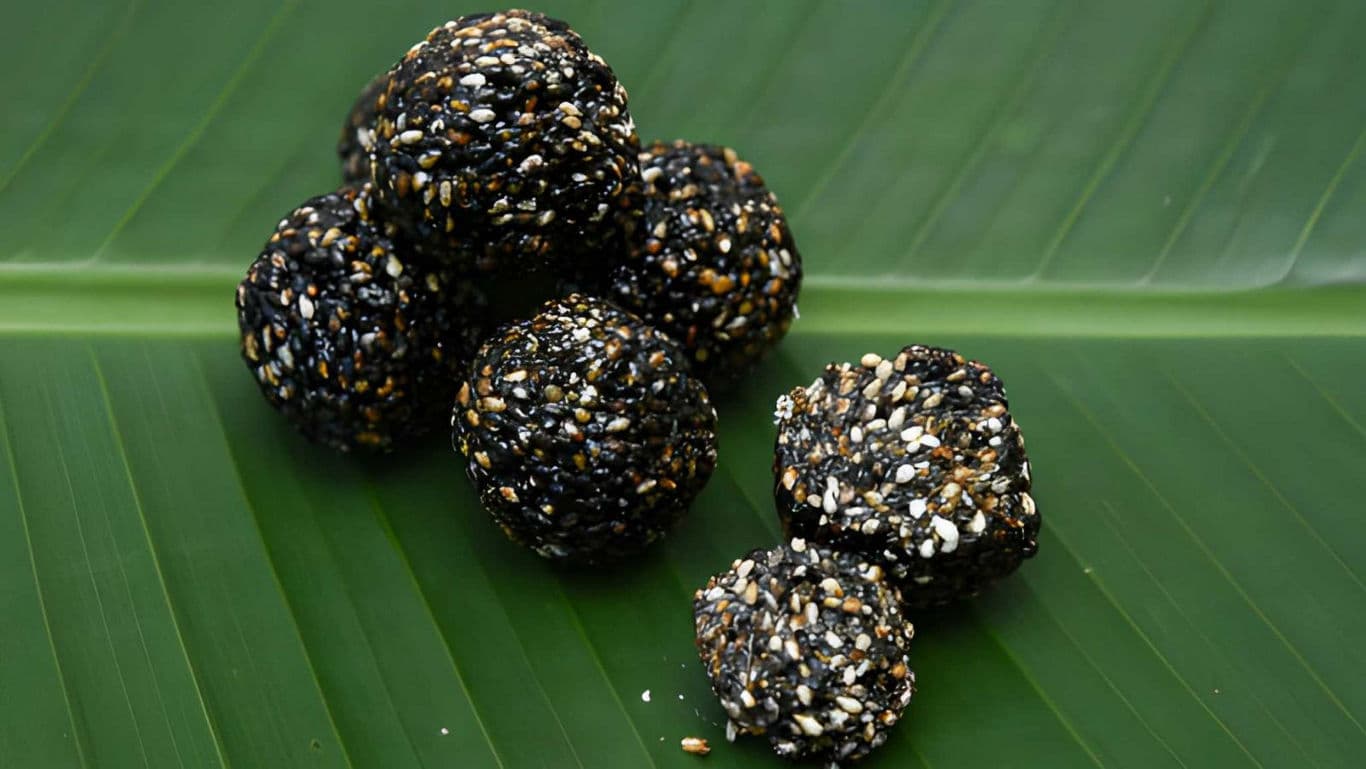 Black sesame seed balls on banana leaf