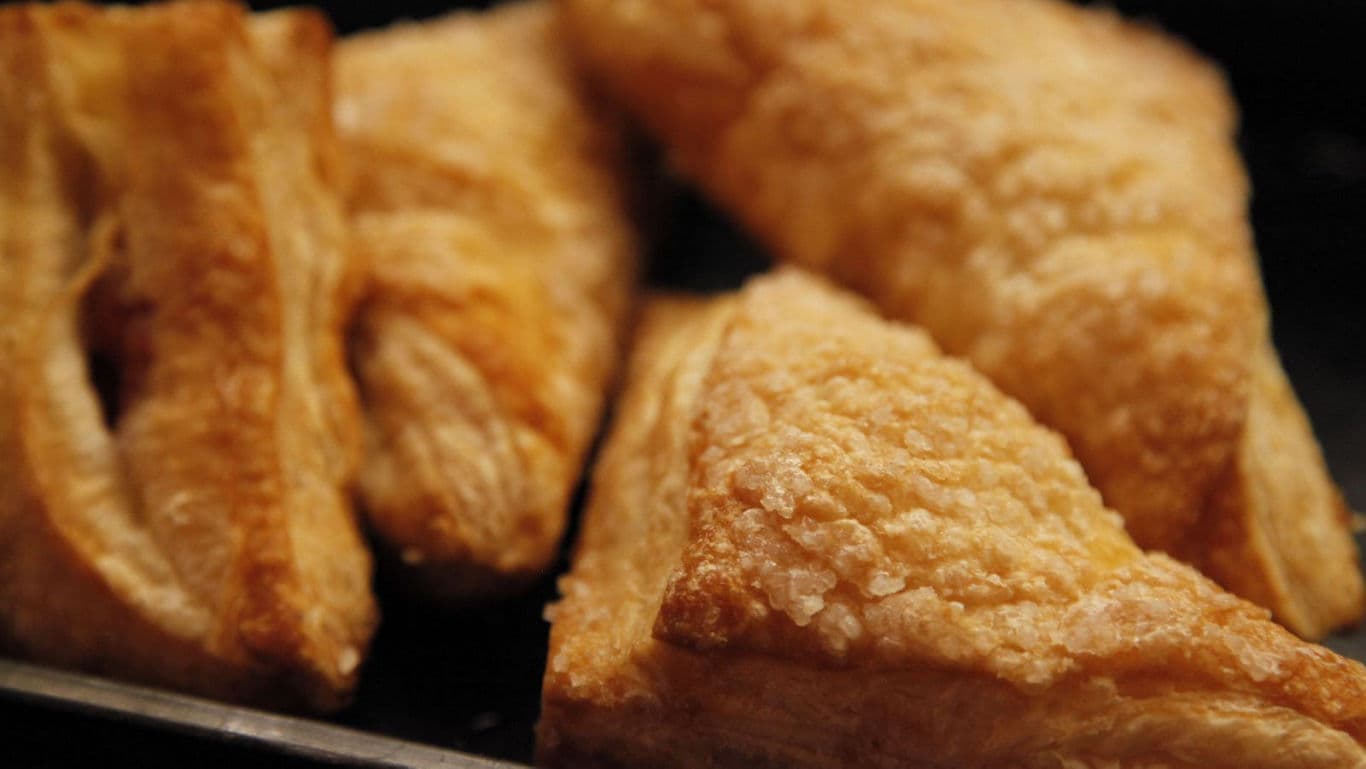 Close-up of golden flaky pastry triangles