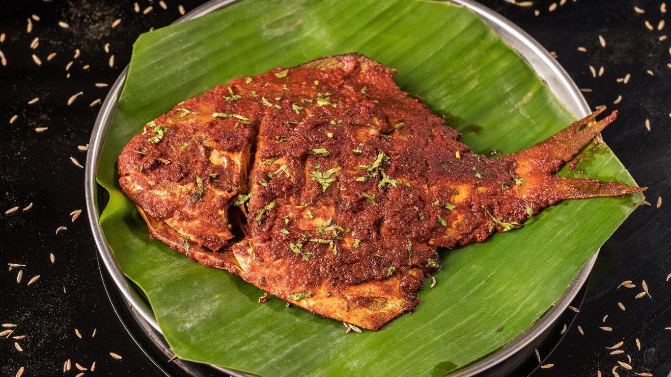 Spicy grilled fish on banana leaf