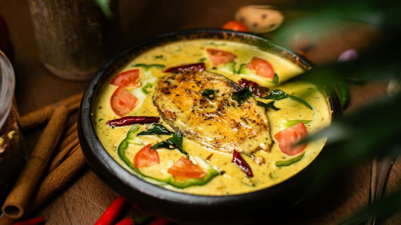 Fish curry in a shallow dish.