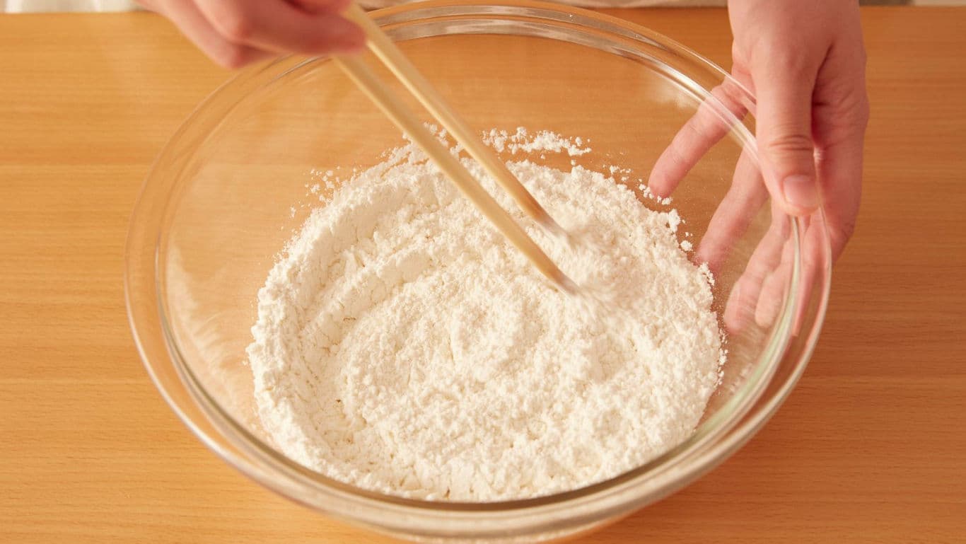 Mixing Powder in Glass Bowl with Chopsticks