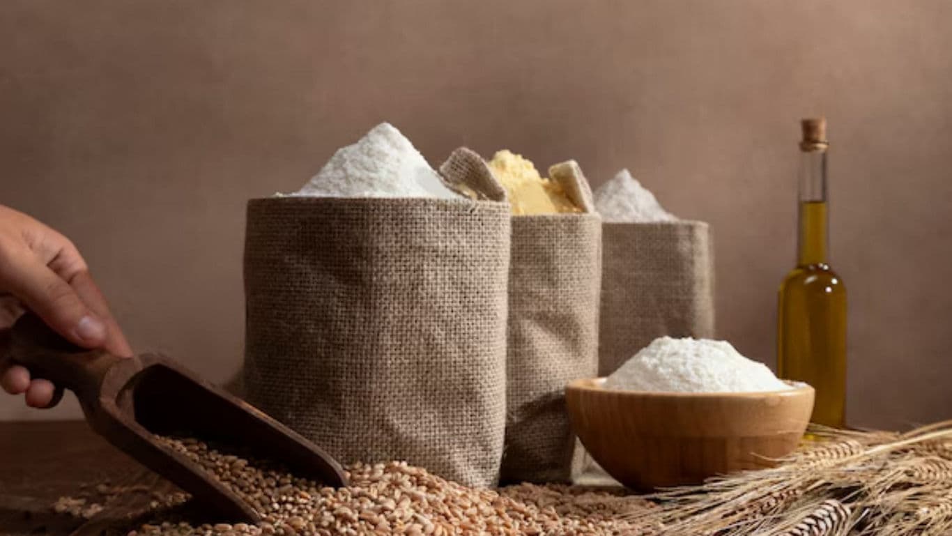 Assorted grains and flour in rustic kitchen setting