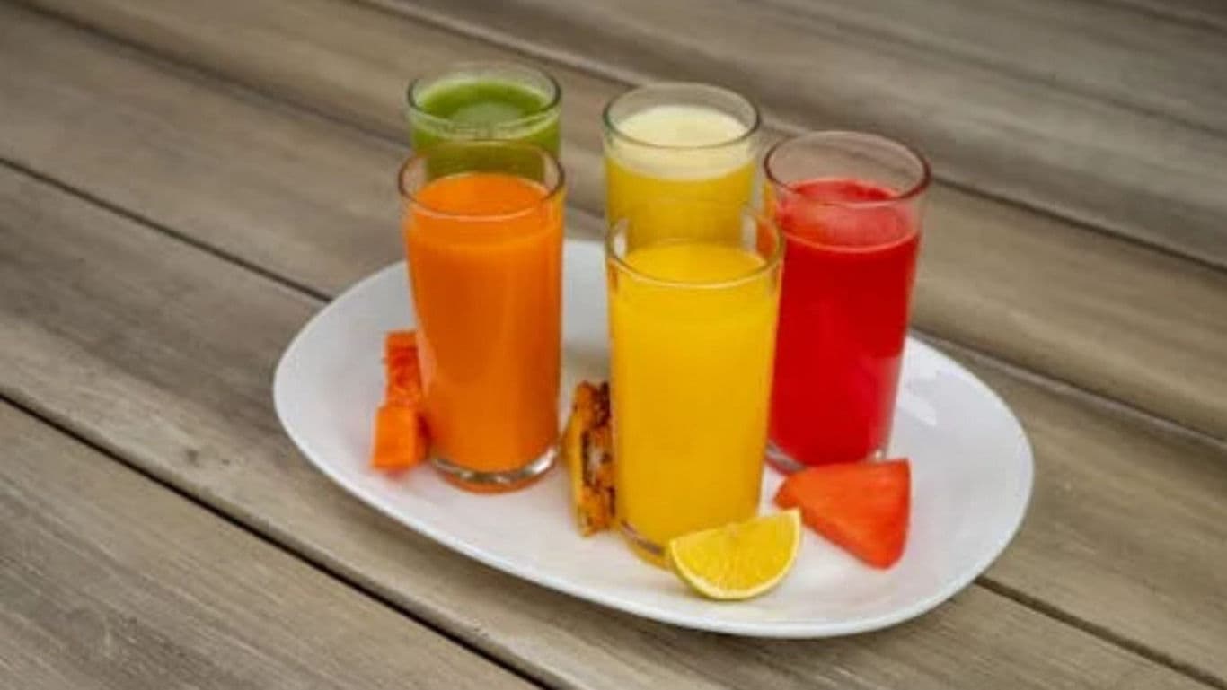 Assorted Fresh Fruit Juices in Glasses on Tray