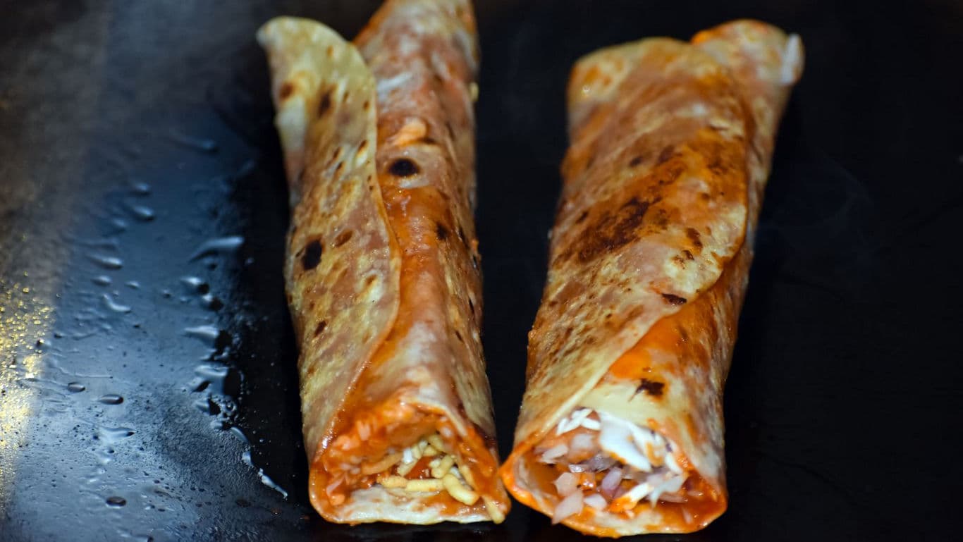 Two Indian Kathi Rolls on Hot Griddle Surface