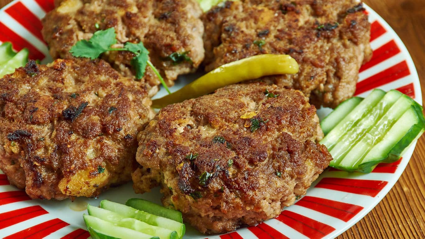 Spiced Meat Patties with Sliced Cucumber and Chili