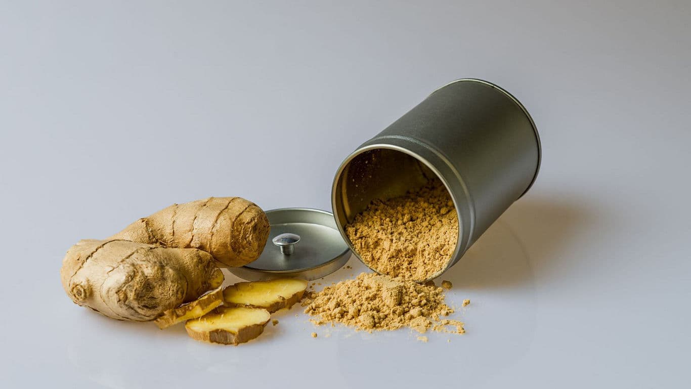 Ground ginger spilling from metal container