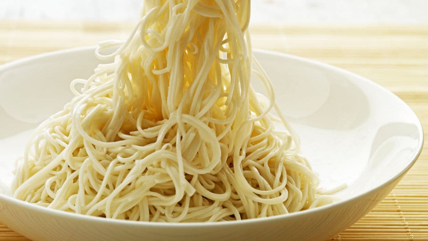 Plain cooked noodles in white bowl