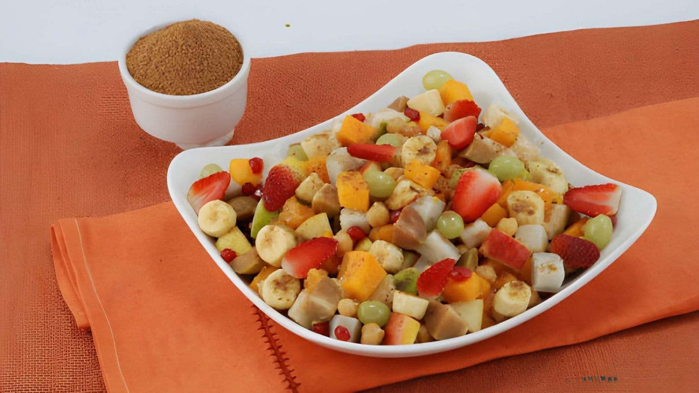 Colorful mixed fruit salad in white bowl