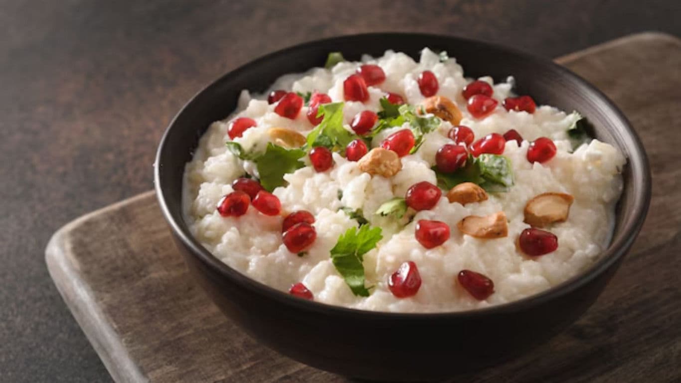 Creamy rice dish with pomegranate garnish