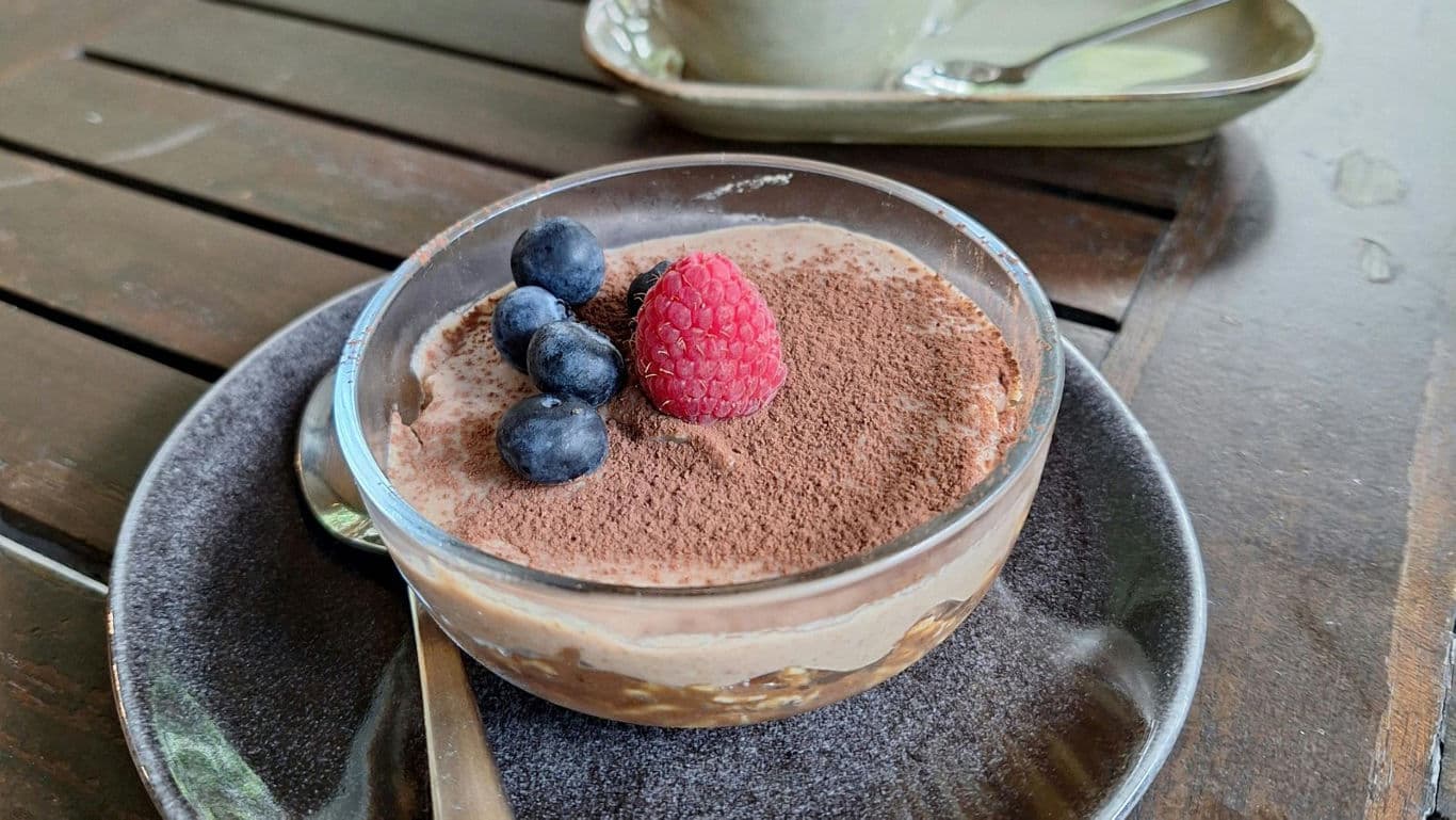 Chocolate mousse dessert with berries on table